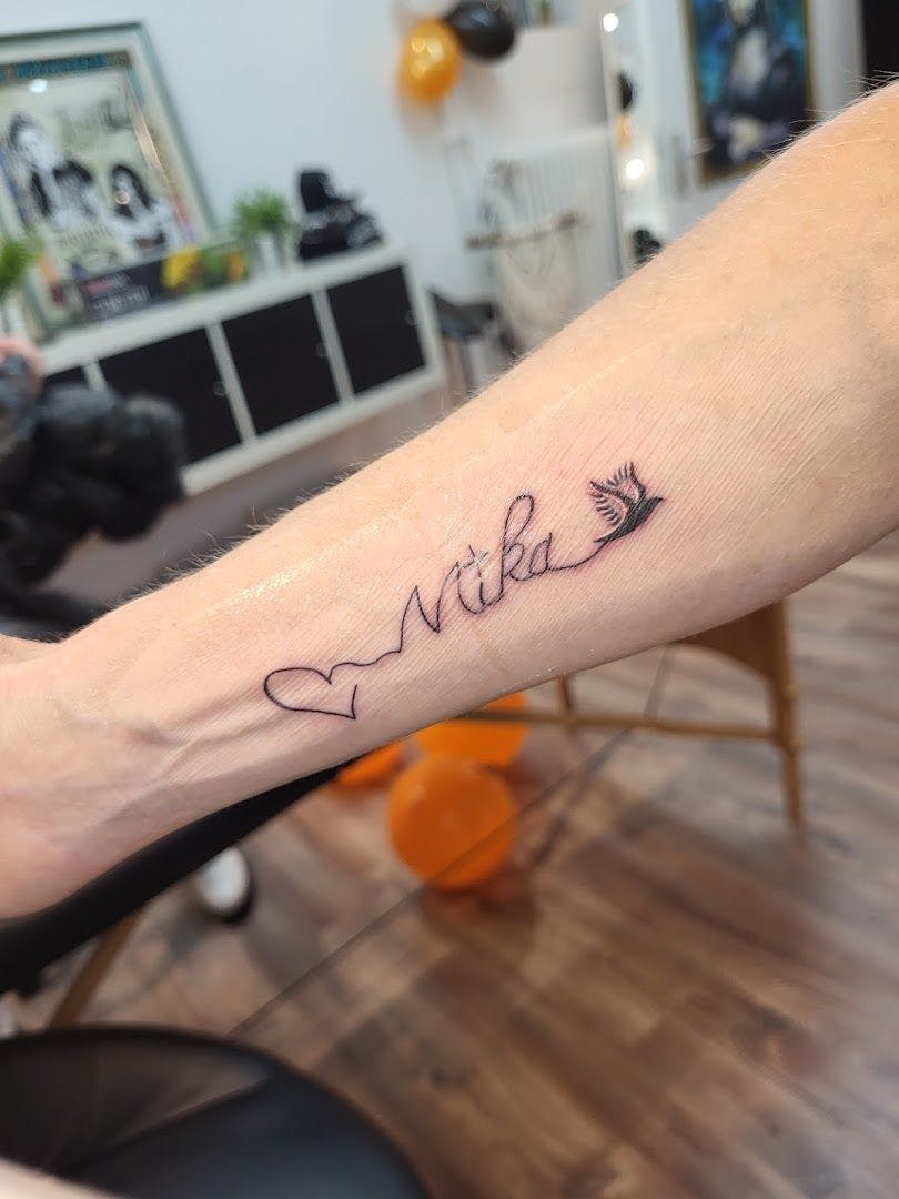 a narben tattoo with the word love on it, emmendingen, germany