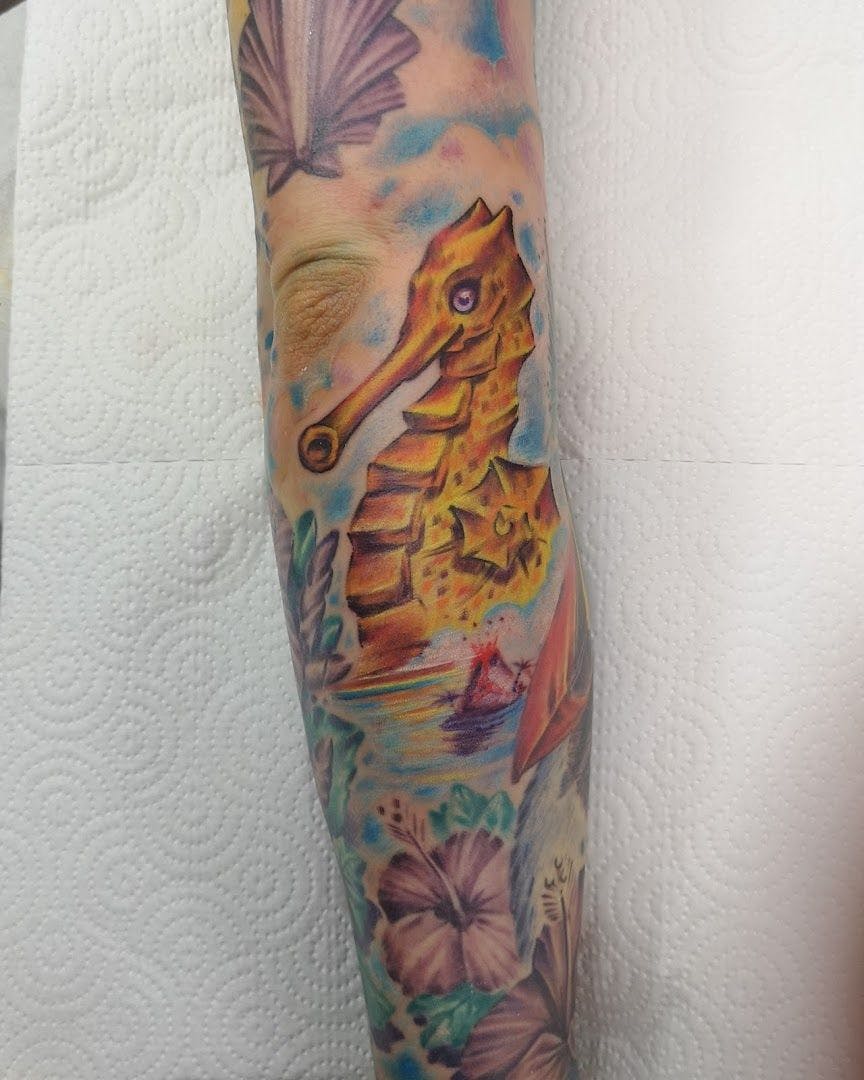 a colorful narben tattoo with a horse and flowers, northeim, germany