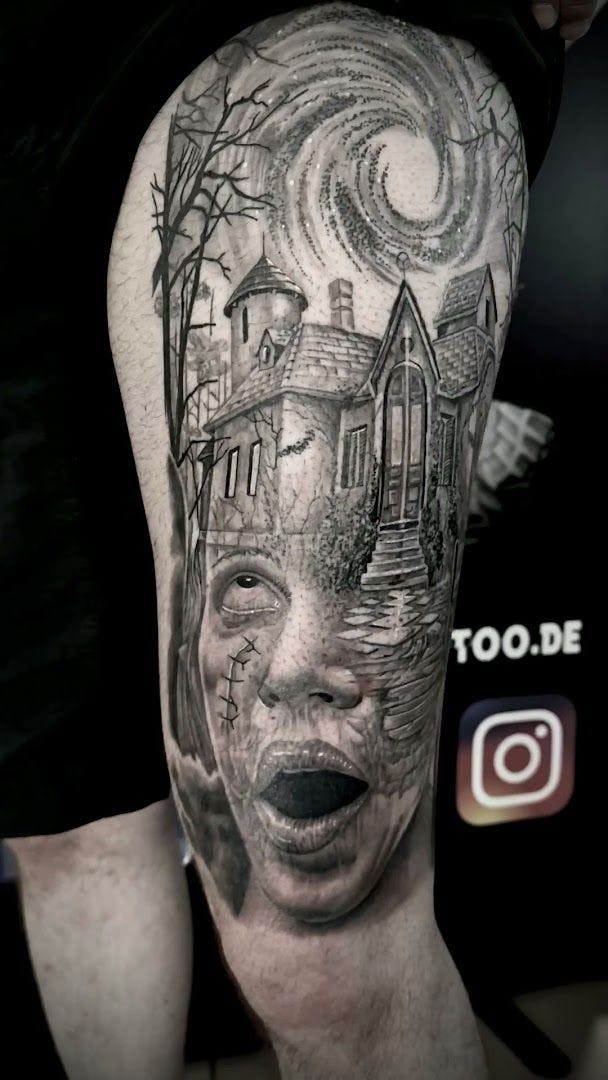 a man's leg with a cover-up tattoo of a house and a tree, erlangen-höchstadt, germany