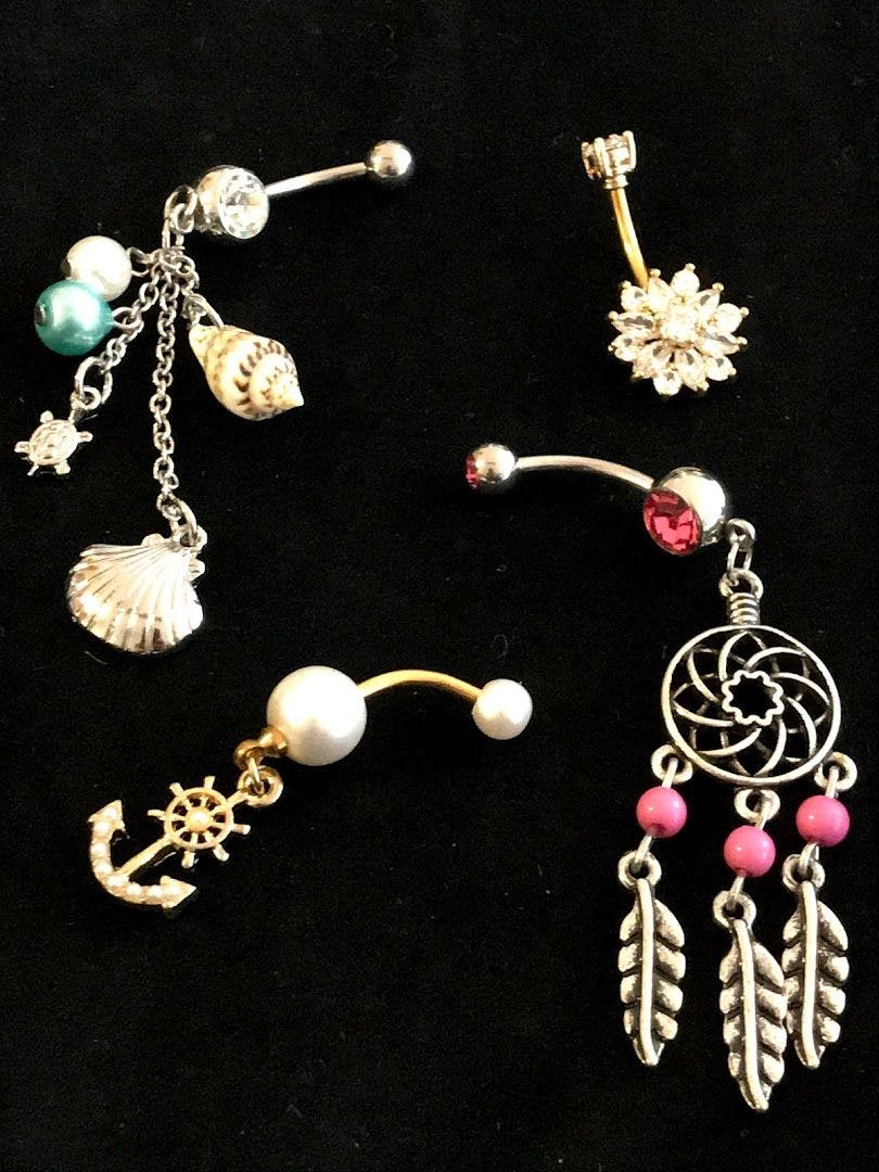 a collection of jewelry including a necklace, earrings and a ring