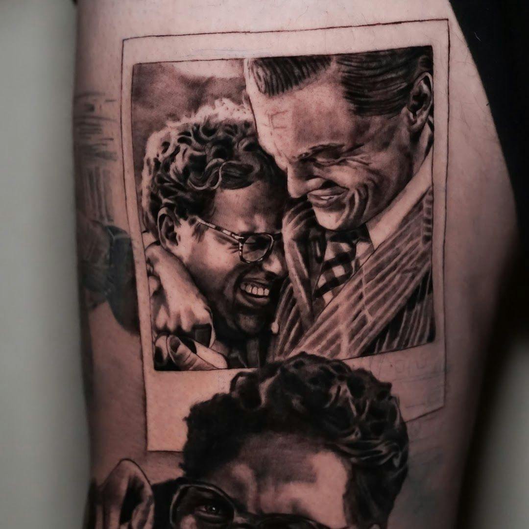 a cover-up tattoo of two men with a picture of them and a woman, hamburg, germany