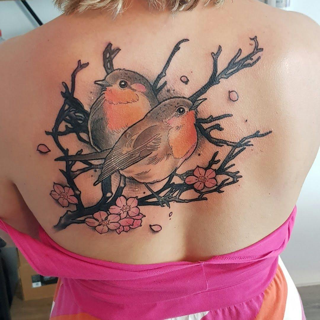 a woman with a cover-up tattoo on her back, rhein-erft district, germany