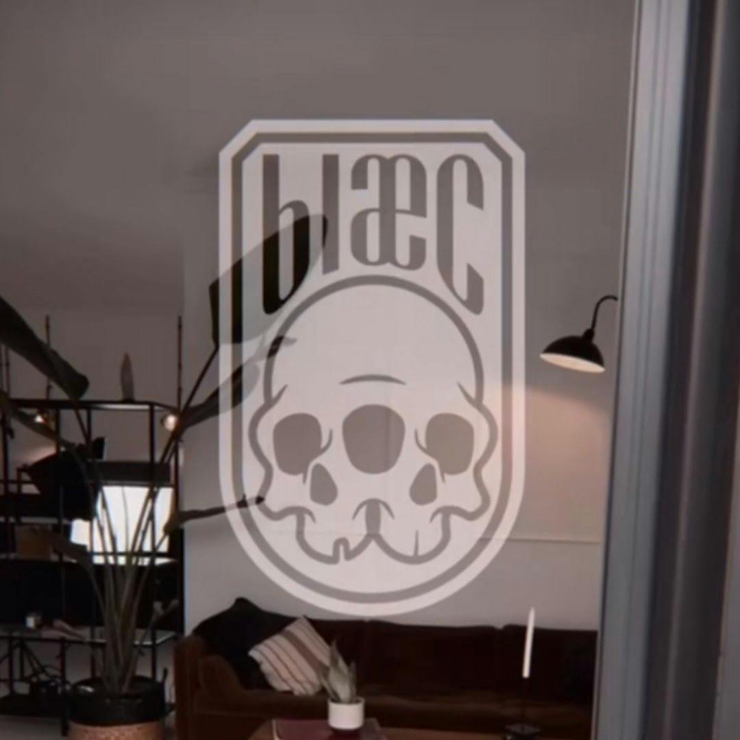 a room with a couch and a skull sticker