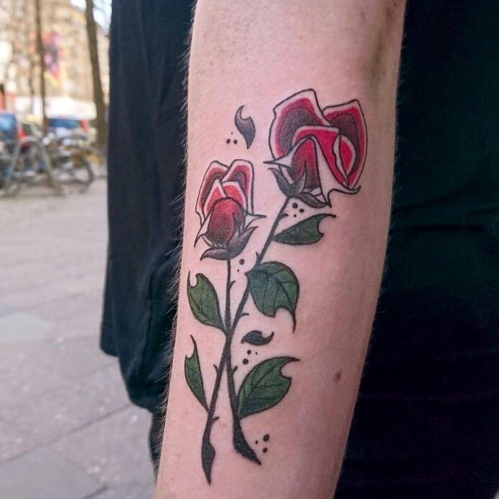 a cover-up tattoo with a rose on the arm, berlin, germany