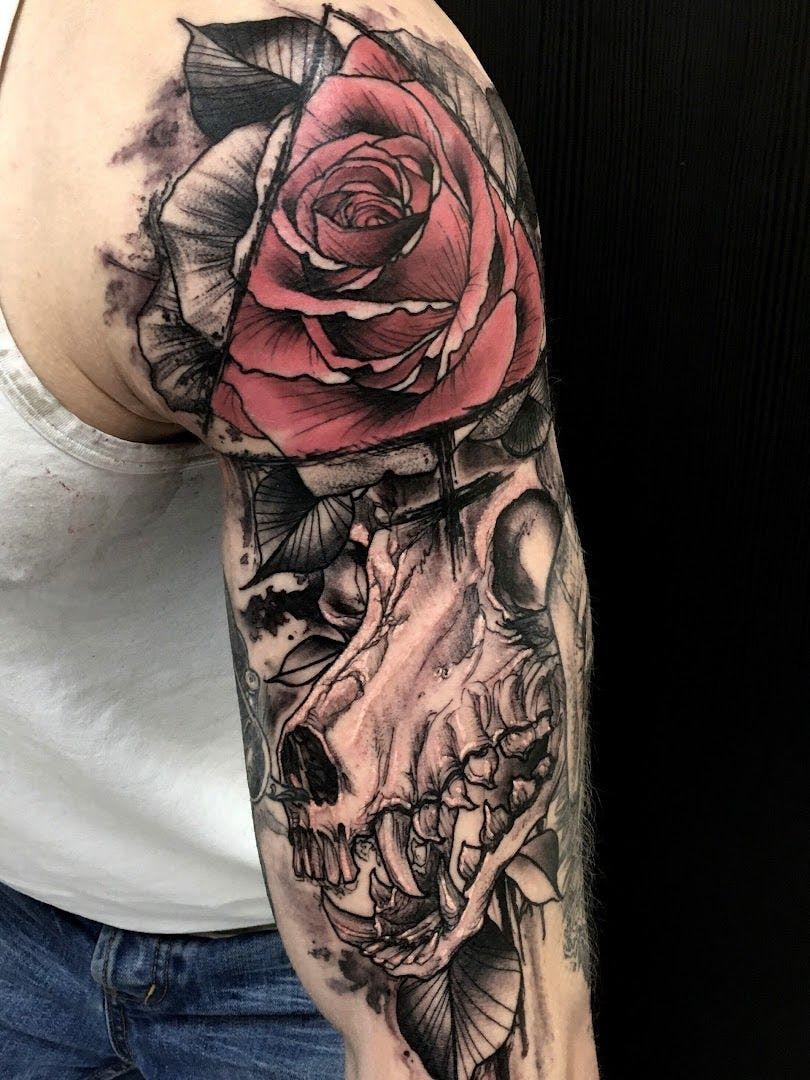 a rose and skull cover-up tattoo on the arm, rhein-erft district, germany