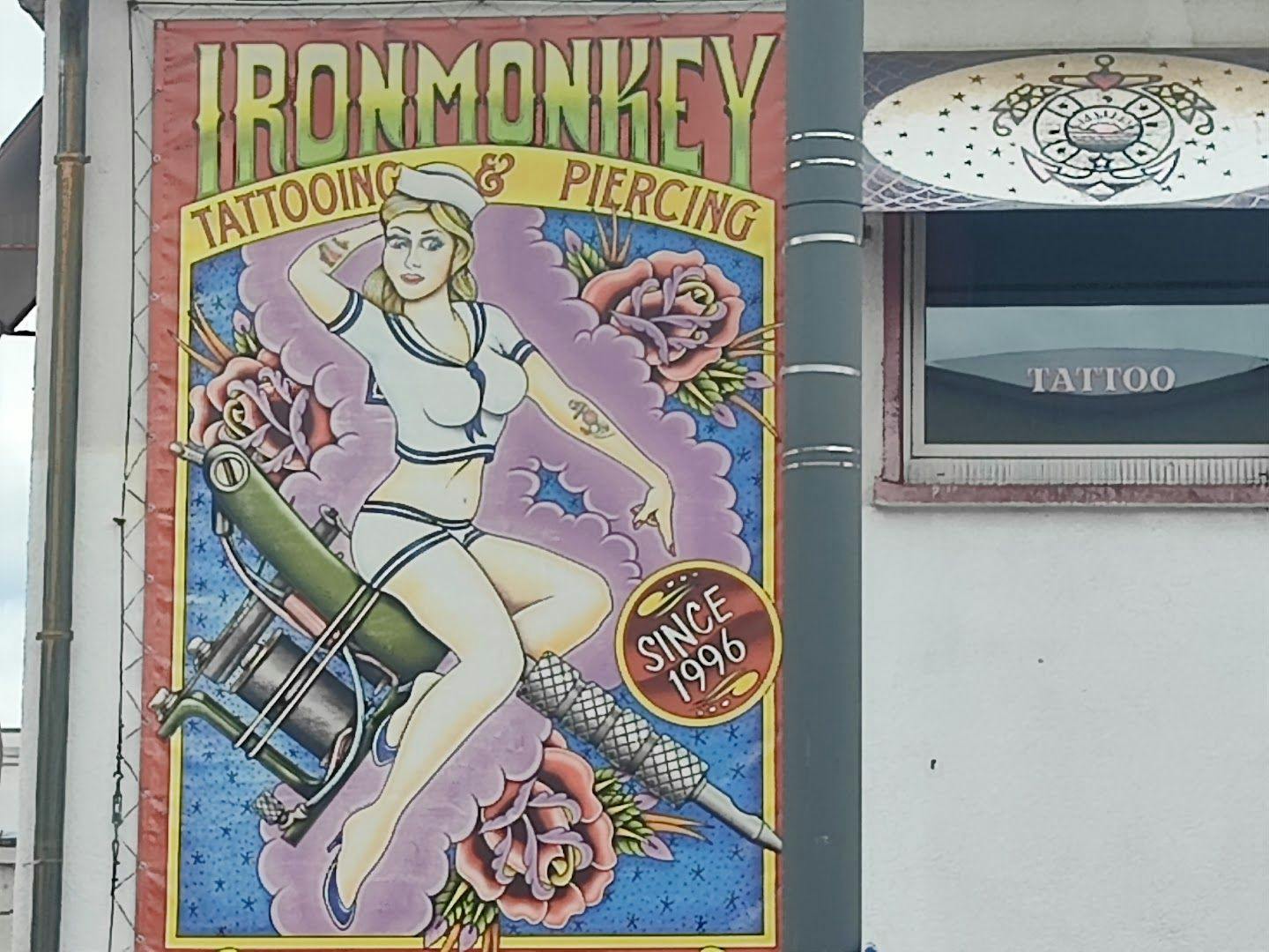 a sign on a building with a woman on it