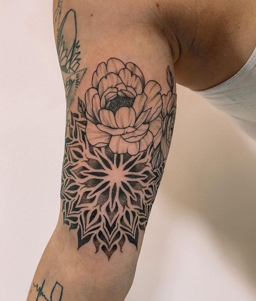 a woman's arm with a black and white cover-up tattoo design, zollernalbkreis, germany
