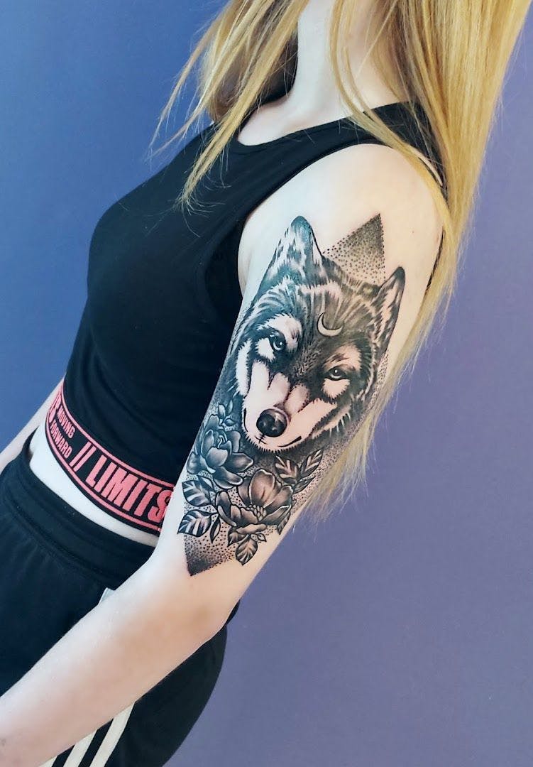 a woman with a cover-up tattoo on her arm, altenkirchen, germany