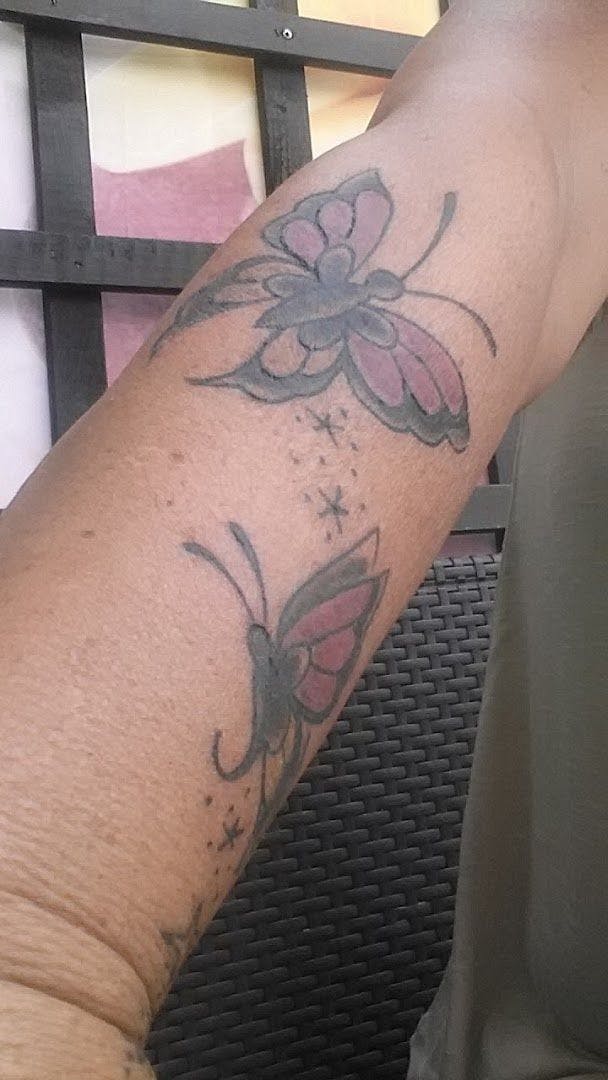 a person with a cover-up tattoo on their arm, ennepe-ruhr-kreis, germany