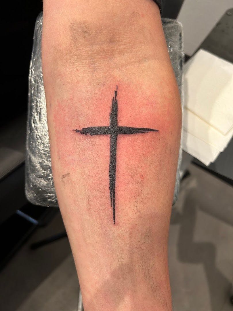 a cross narben tattoo on the forearm, biberach, germany