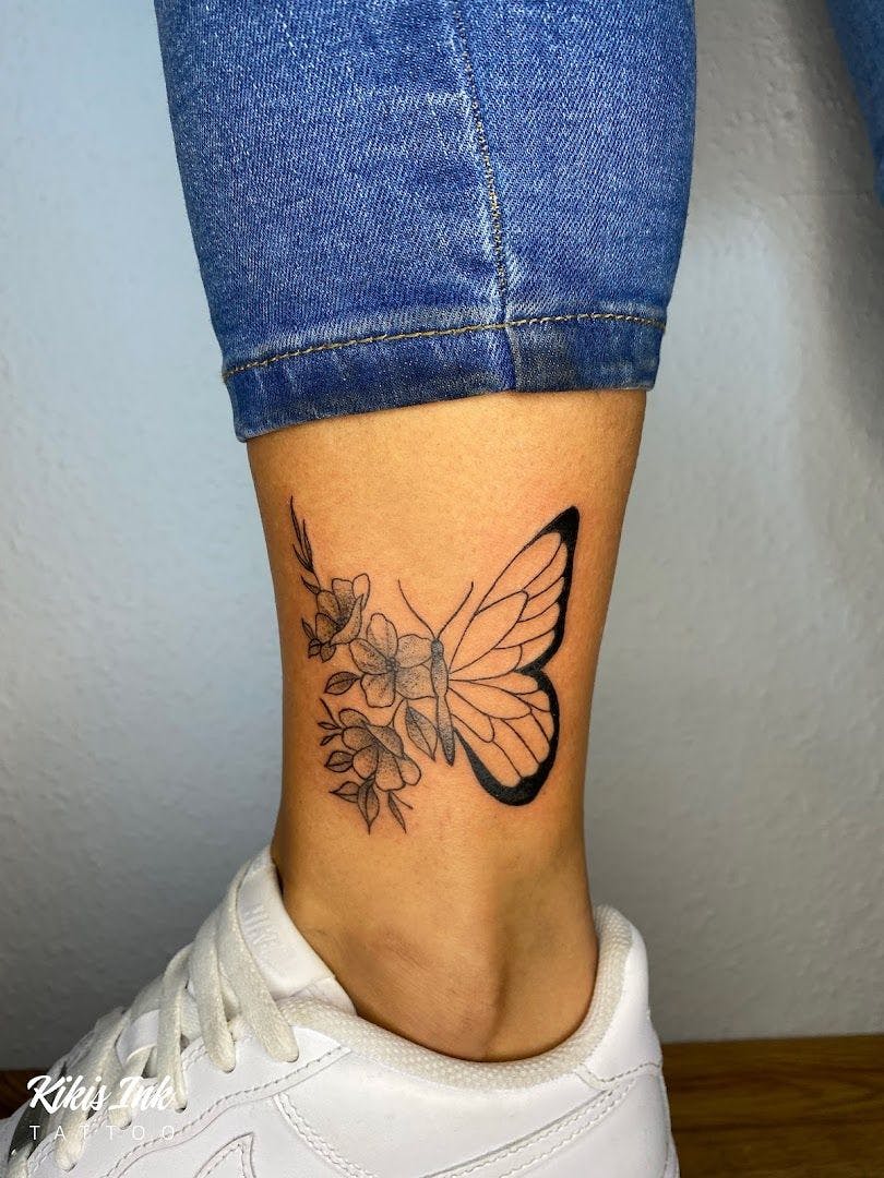 a small butterfly narben tattoo on the ankle, minden-lübbecke, germany