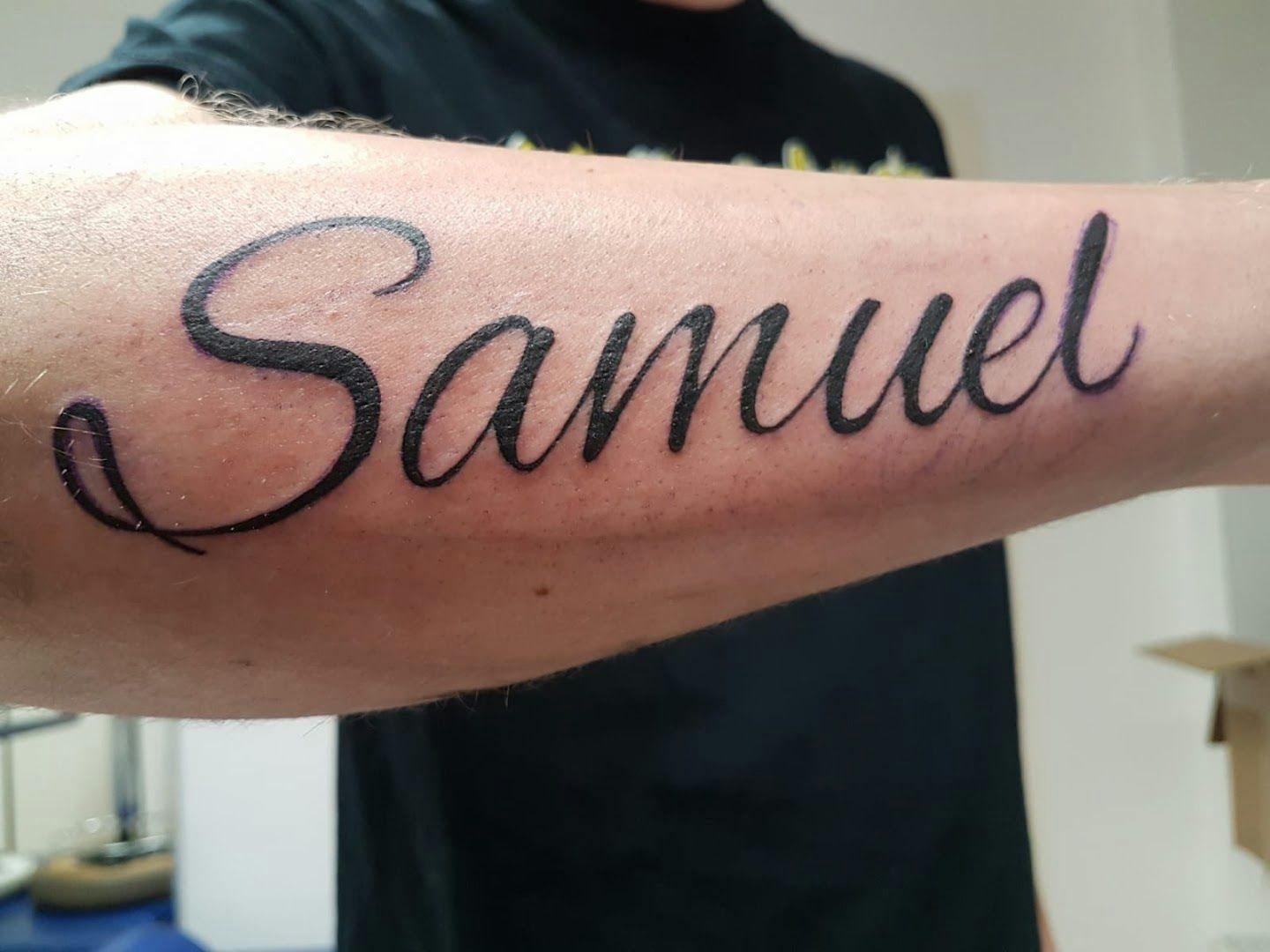 a man with a cover-up tattoo that says same, soest, germany