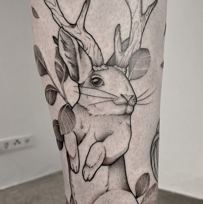 a cover-up tattoo of a deer with leaves on its head, bielefeld, germany
