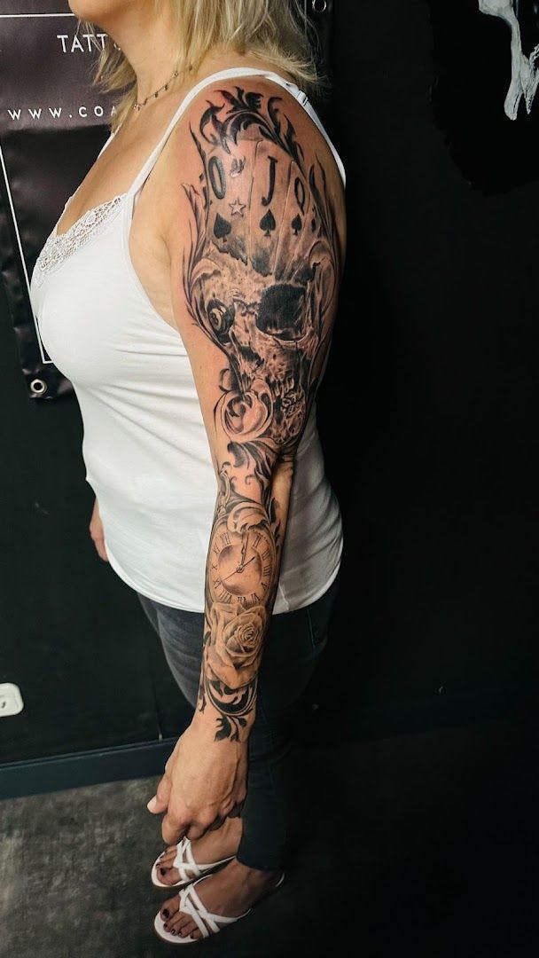 a woman with a totenkopf tattoos on her arm, wesel, germany