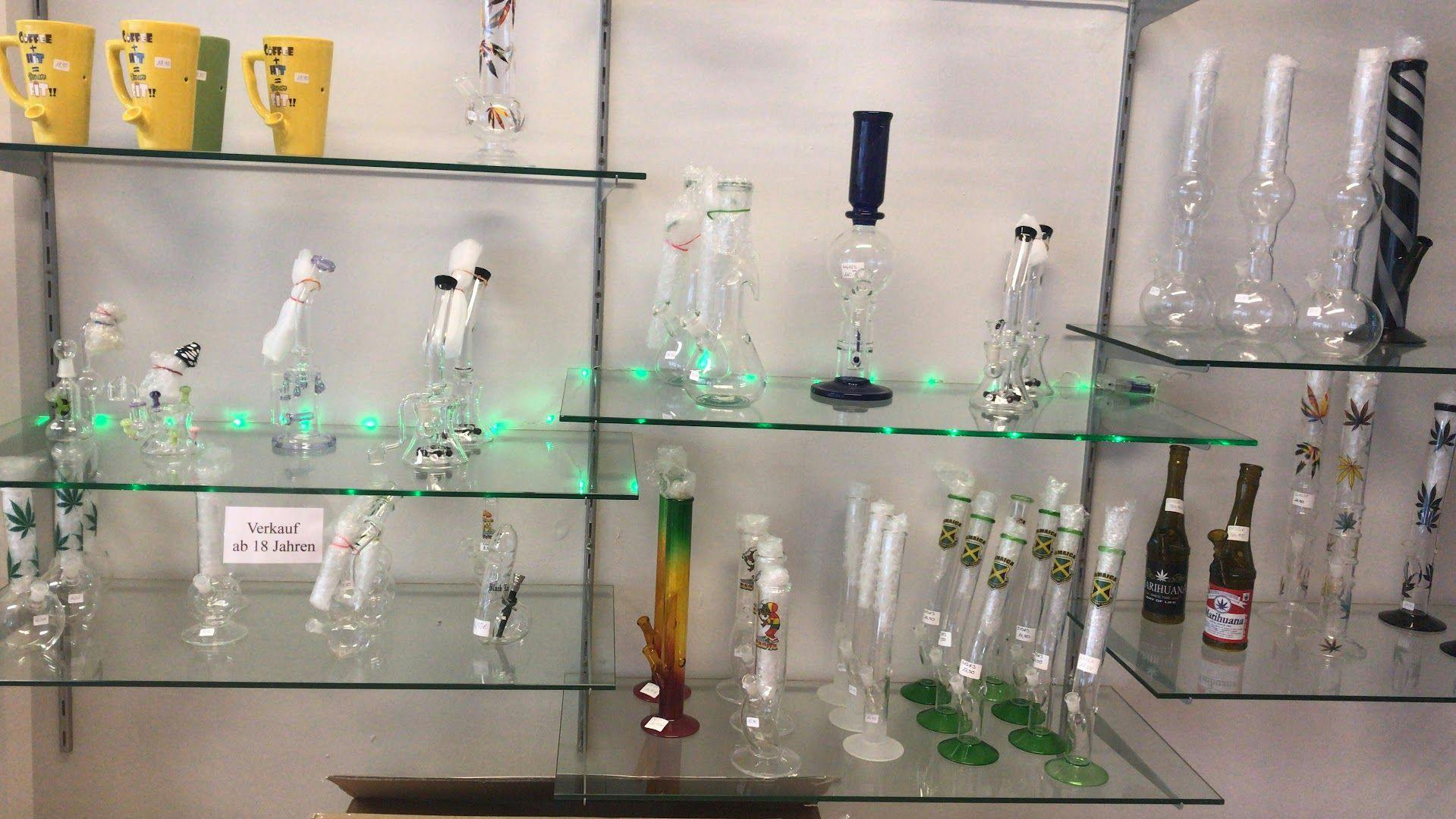 a display of various glass bottles and bottles