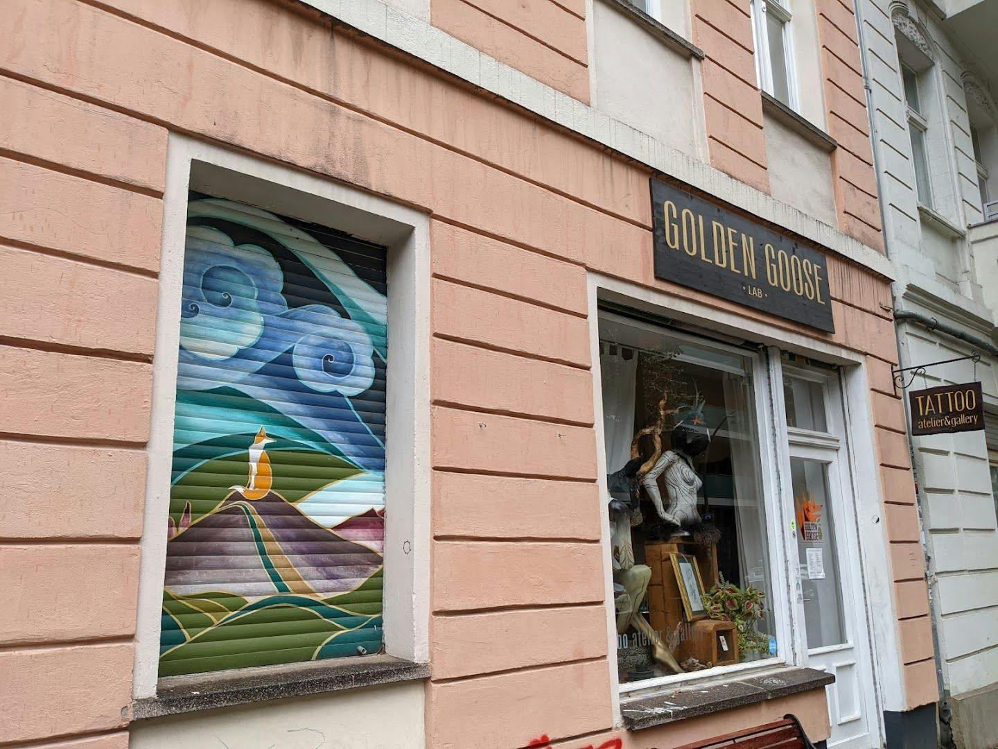 a store window with a painting of a bird in it