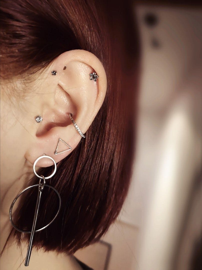 a woman with a piercing piercing on her ear