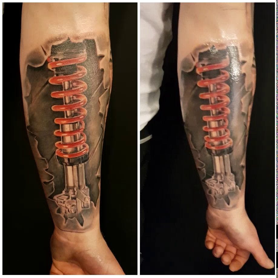 a cover-up tattoo of a gun and a gun with a gun in the middle, bochum, germany