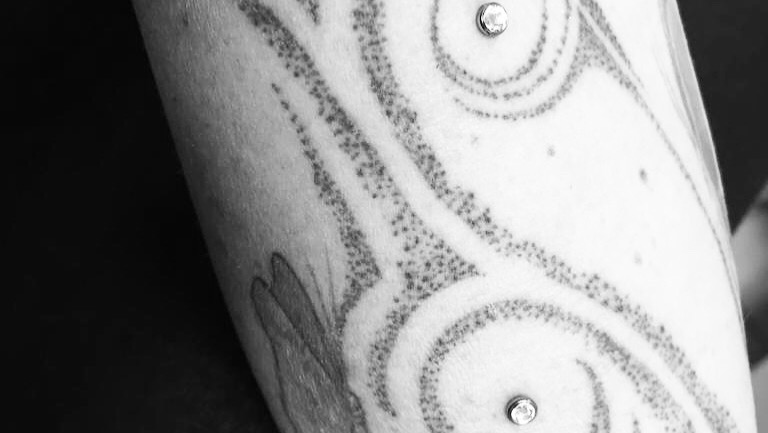a cover-up tattoo with a spiral design on the arm, soest, germany