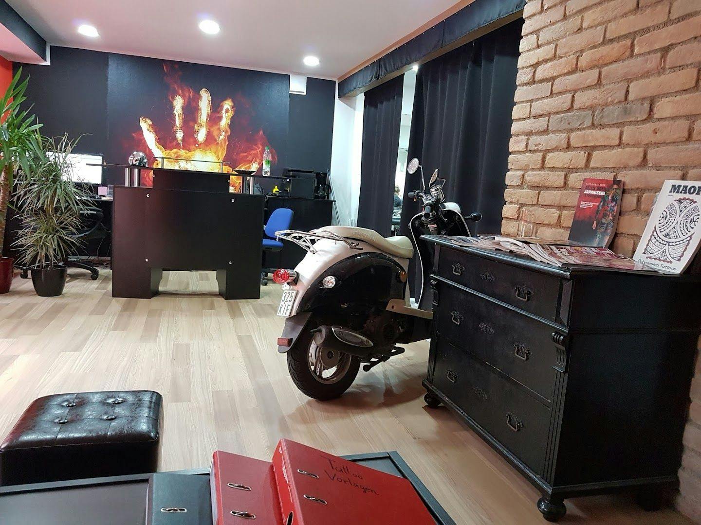 a motorcycle parked in a room with a fire in the background