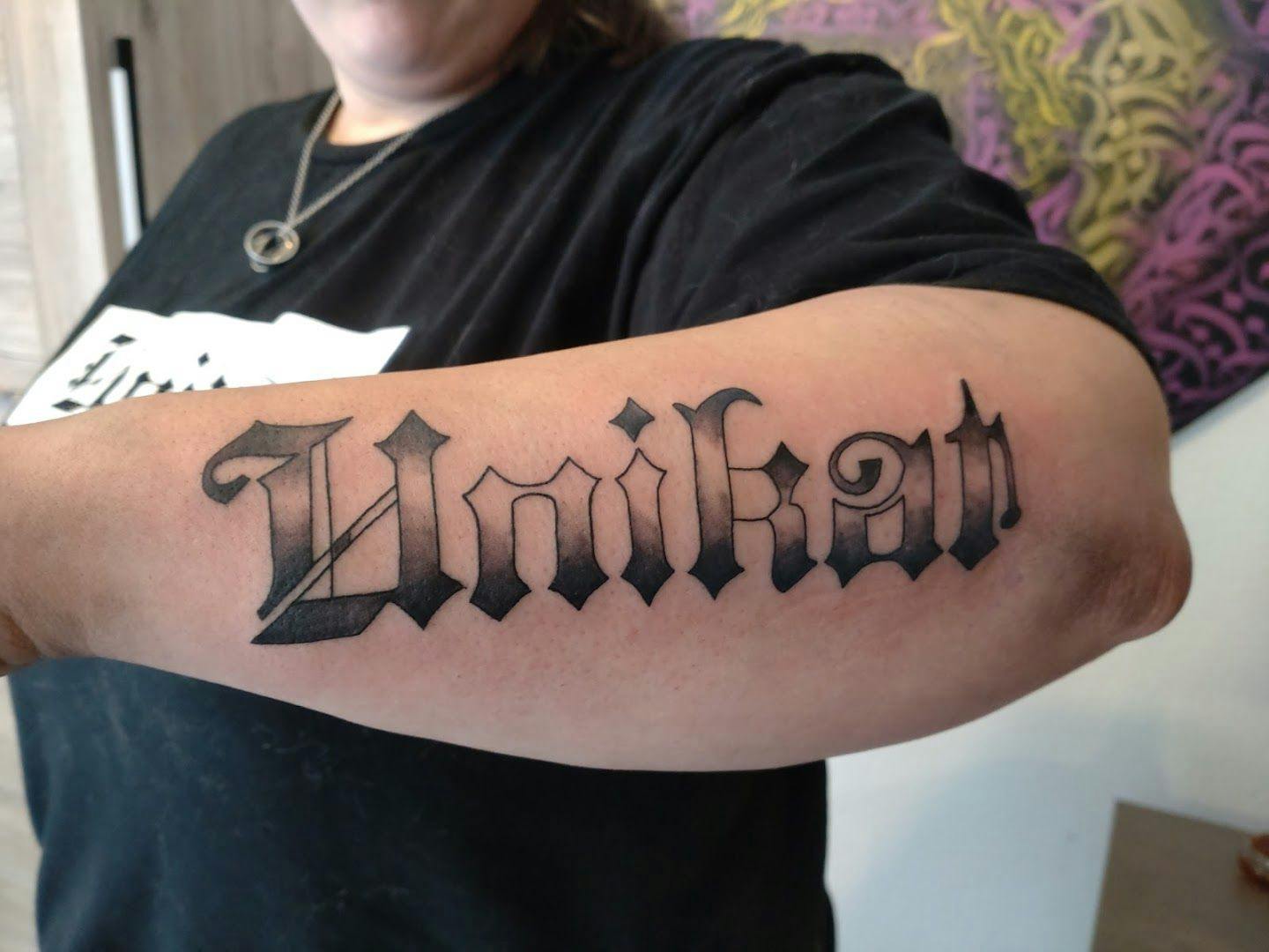 a blackwork tattoo with the word'd'on it, esslingen, germany