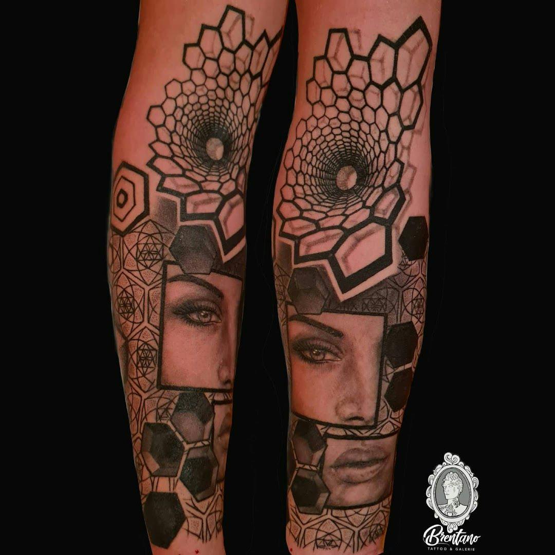 a woman's face with a geometric pattern on her leg