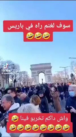 a crowd of people gathered outside the arc triumph in paris