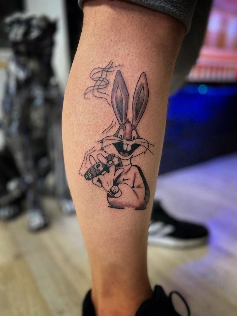 a rabbit cover-up tattoo on the leg, oldenburg, germany