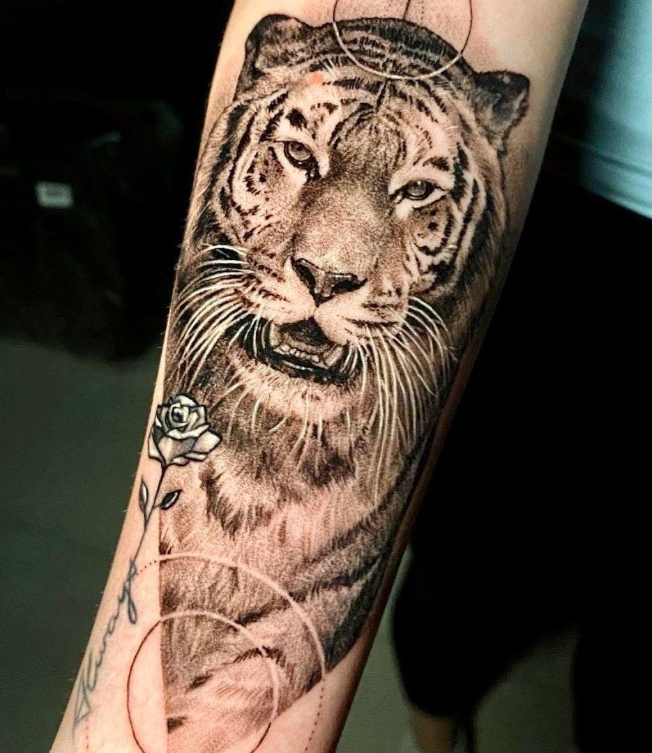 a tiger cover-up tattoo on the arm, berlin, germany
