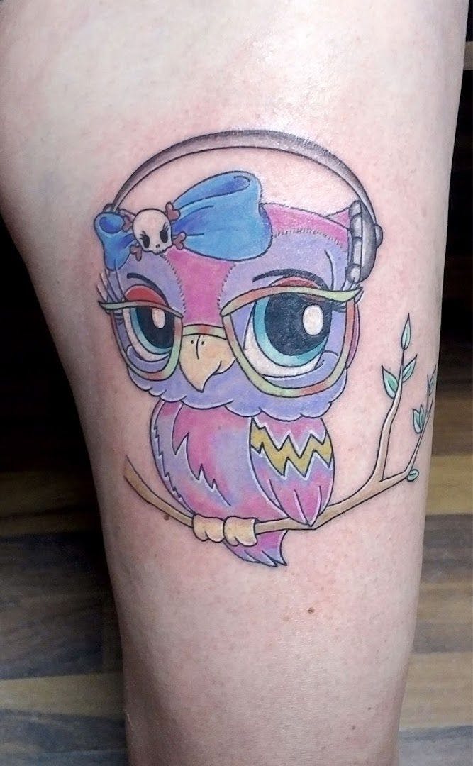 a small japanische tattoos in leipzig of an owl with a hat on it's head, aschaffenburg, germany
