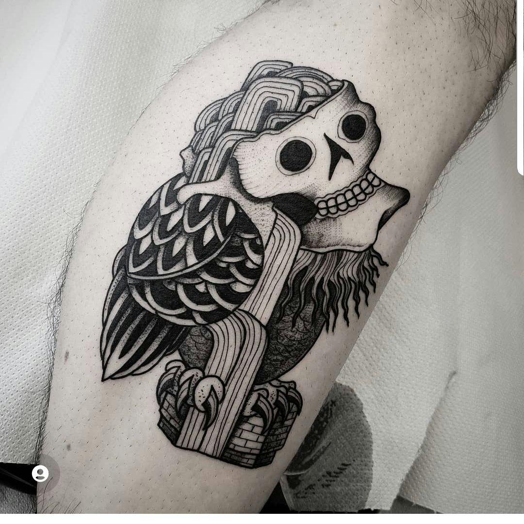 a black and white cover-up tattoo of a skull with a cross, berlin, germany