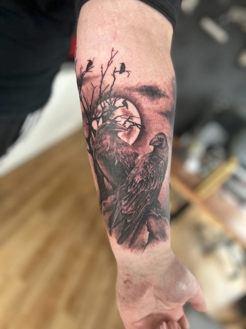 a black and white narben tattoo of a bird on a tree branch, saalekreis, germany