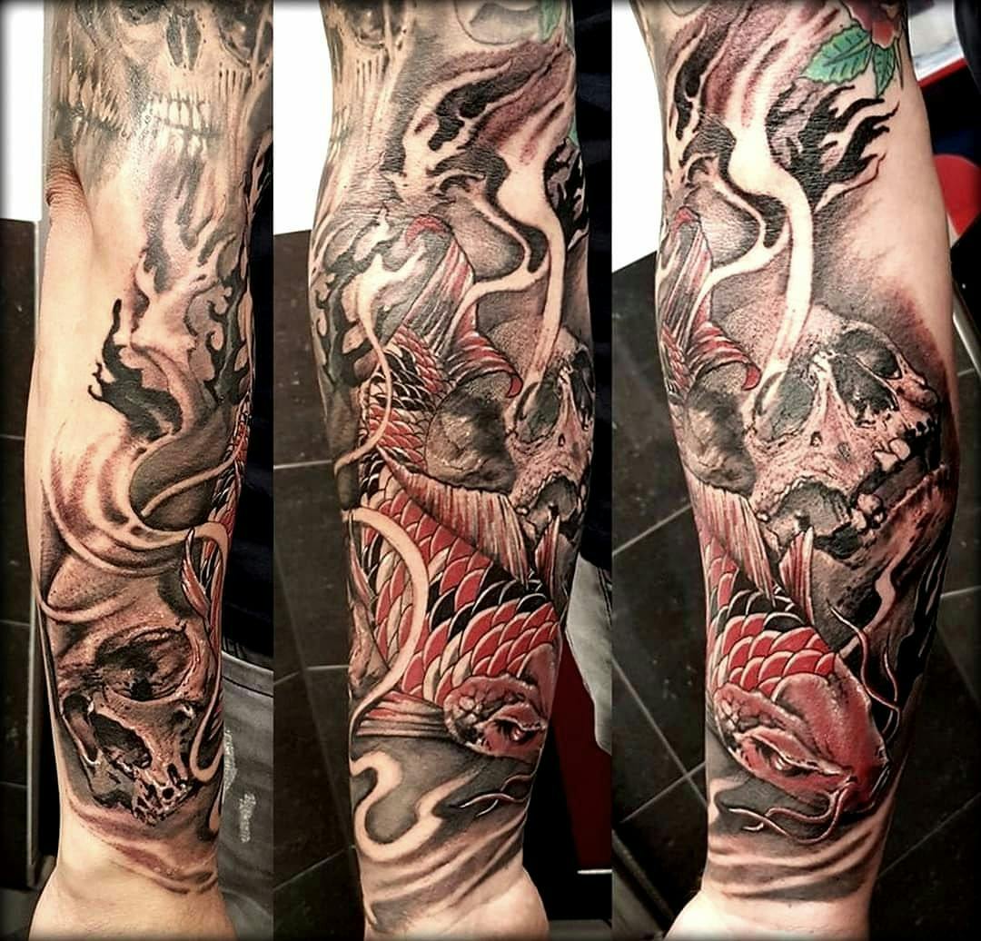 a cover-up tattoo with a dragon and a flower, rostock, germany