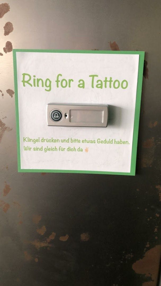 a sign on a refrigerator door that says ring for a to