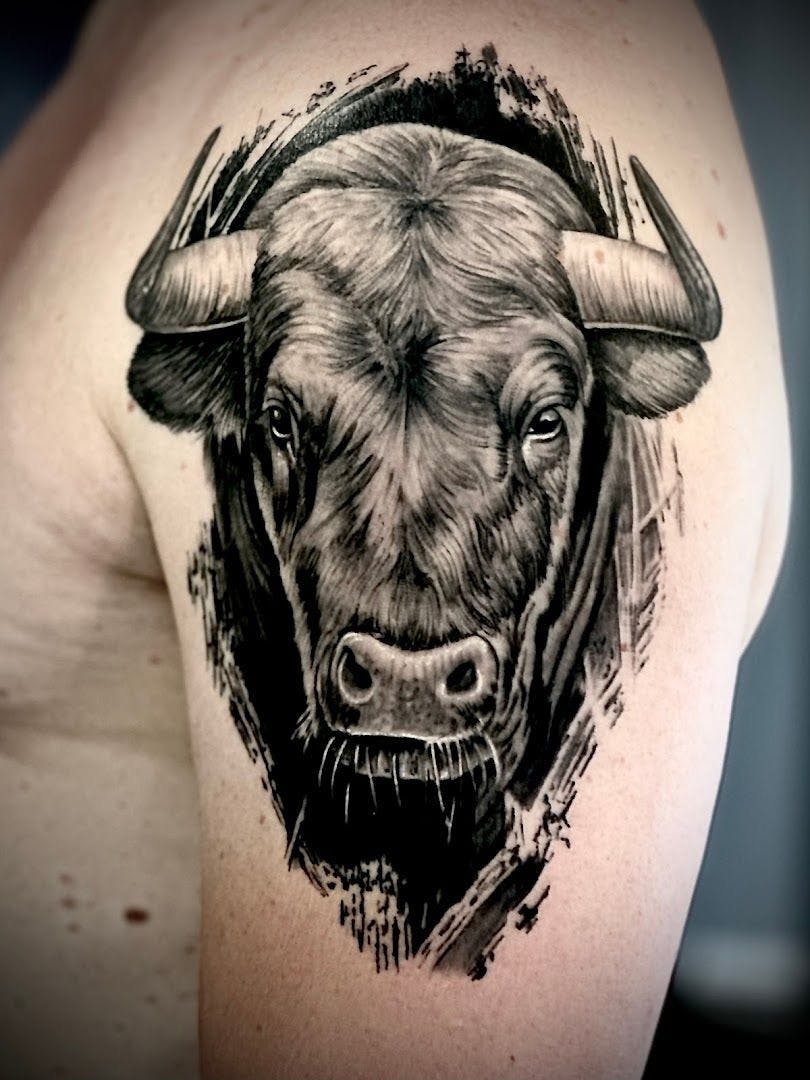 a black and white cover-up tattoo of a cow, erlangen-höchstadt, germany