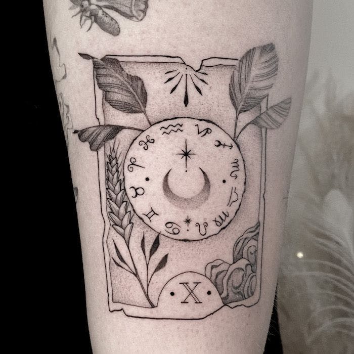 a clock cover-up tattoo on the forearm, bielefeld, germany