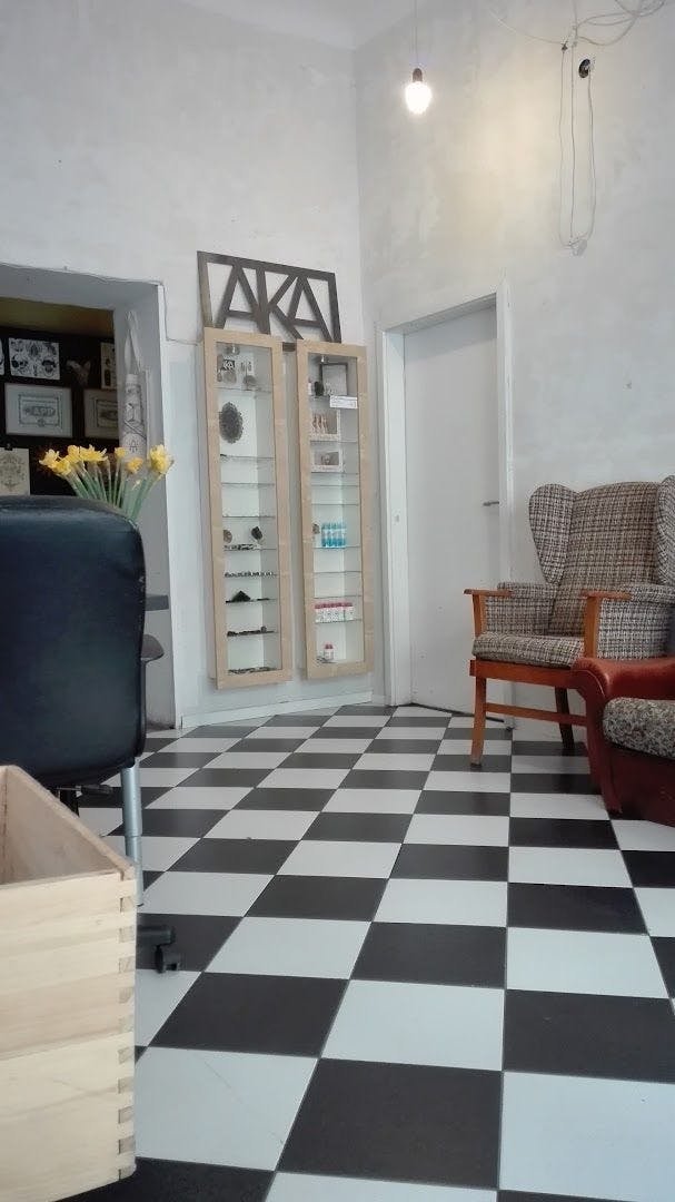 a living room with a checkered floor and a couch