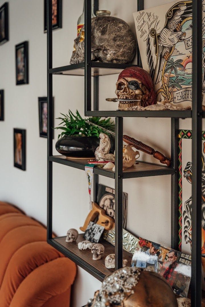 a shelf with skulls and other items on it