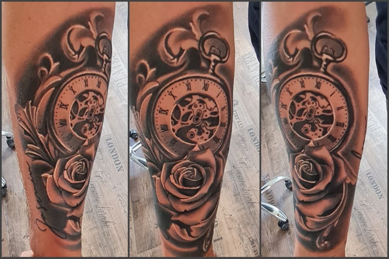 a cover-up tattoo of a clock and roses, berlin, germany
