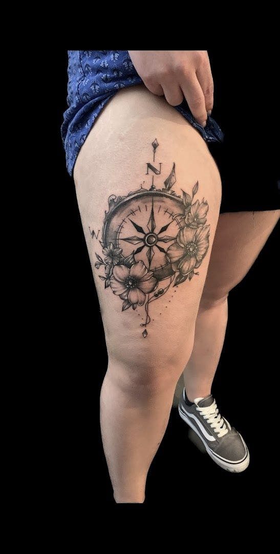 a woman's thigh with a clock cover-up tattoo, böblingen, germany