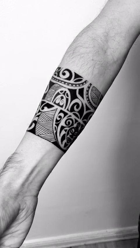 a man's arm with a cover-up tattoo design on it, berlin, germany