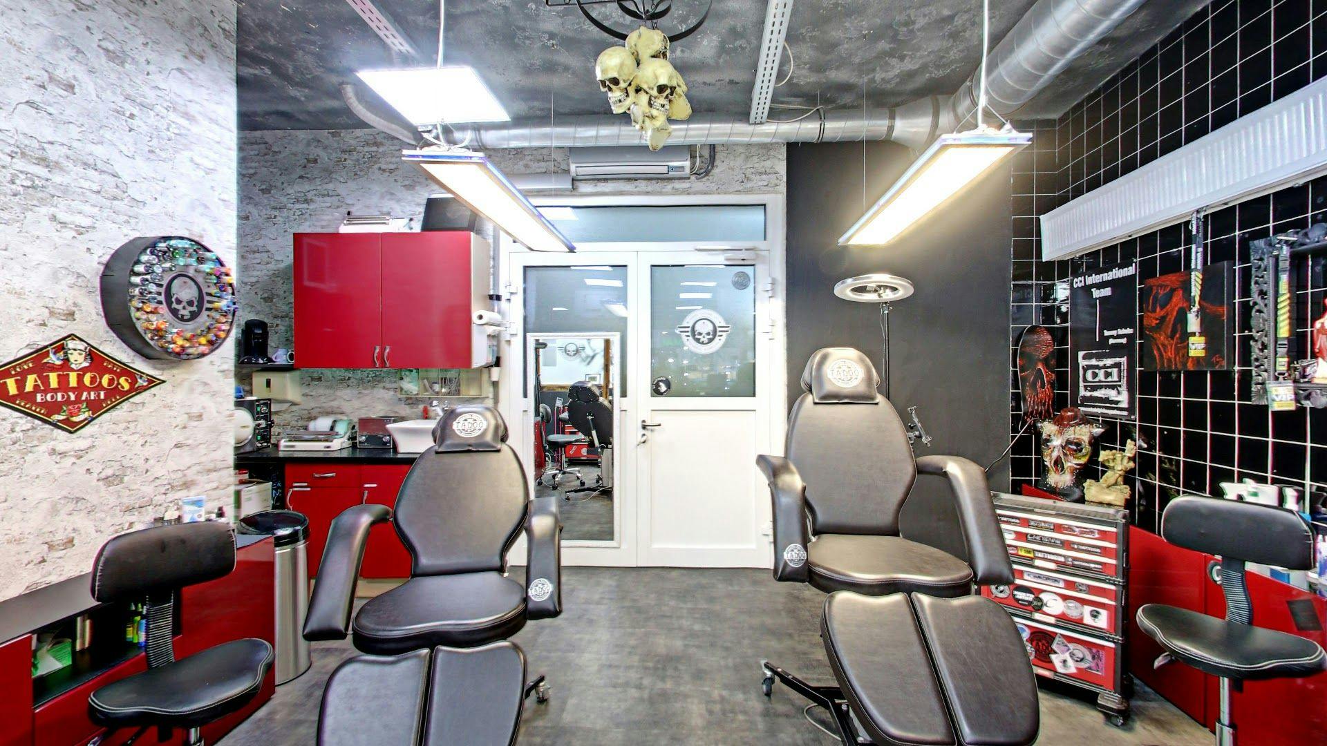 a barber salon with chairs and a mirror