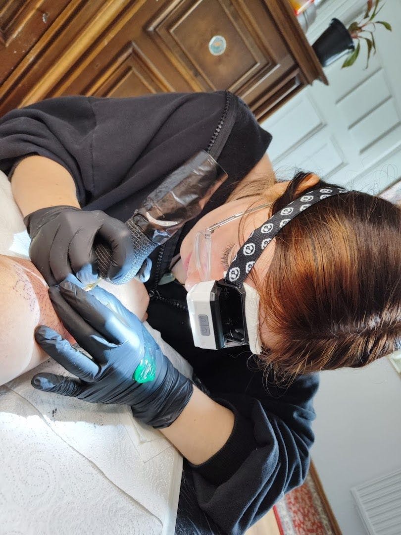 a woman getting her teeth cleaned with a dental device